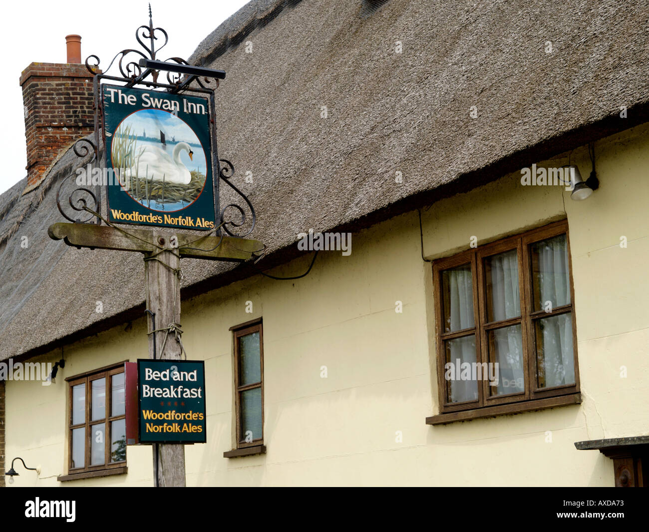 EXTERIOR OF SWAN PUBLIC HOUSE AND SIGN INGHAM NORFOLK EAST ANGLIA