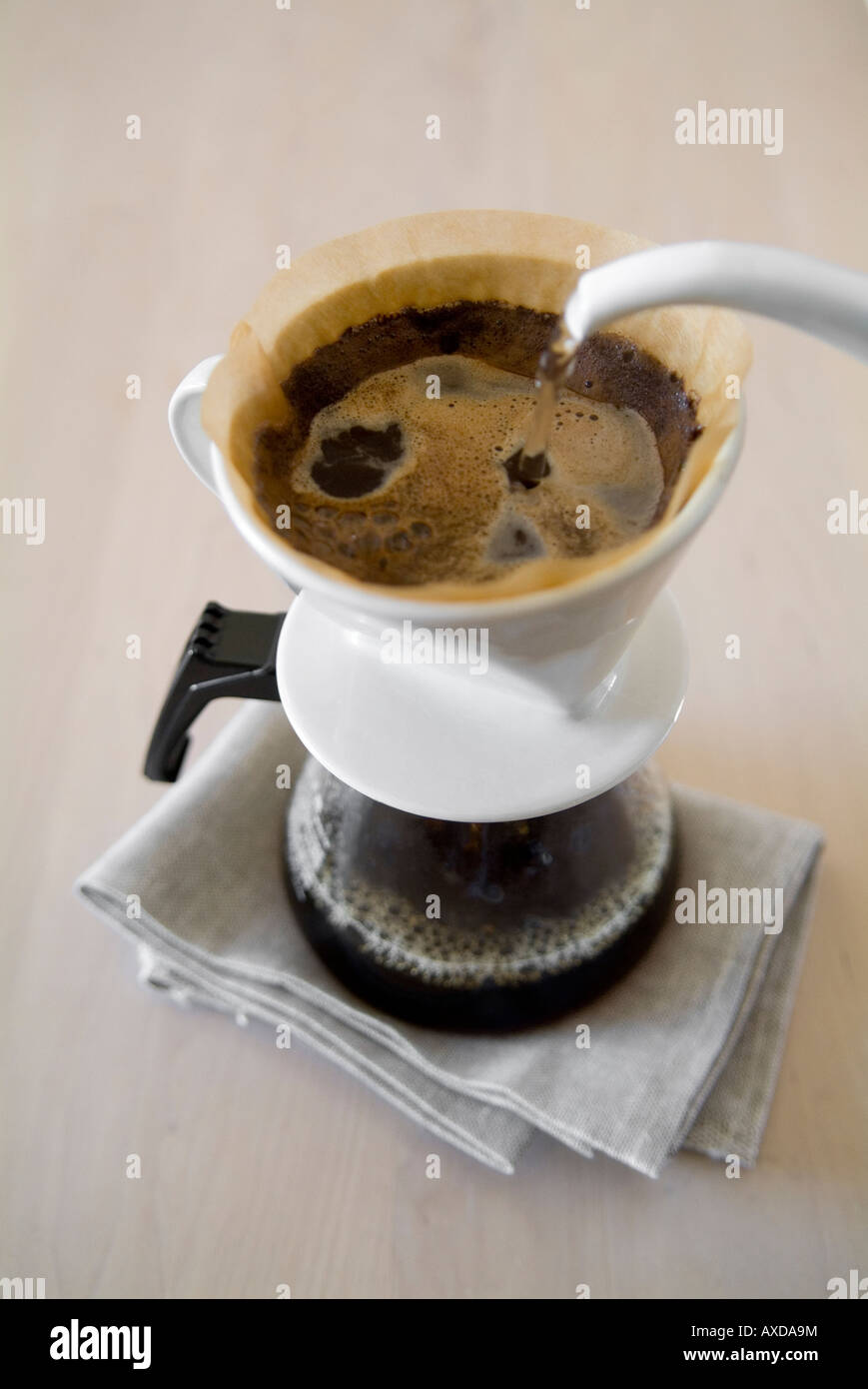 Pouring water into coffee maker Stock Photo Alamy