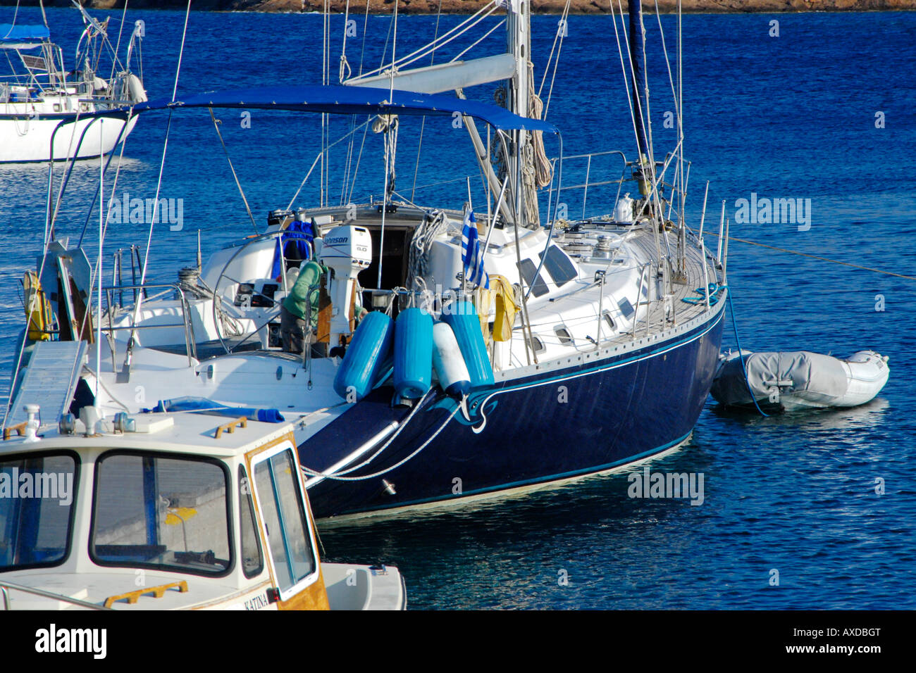 Yacht in harbor, Island of Marathi, Dodecanese Islands, Greece Stock