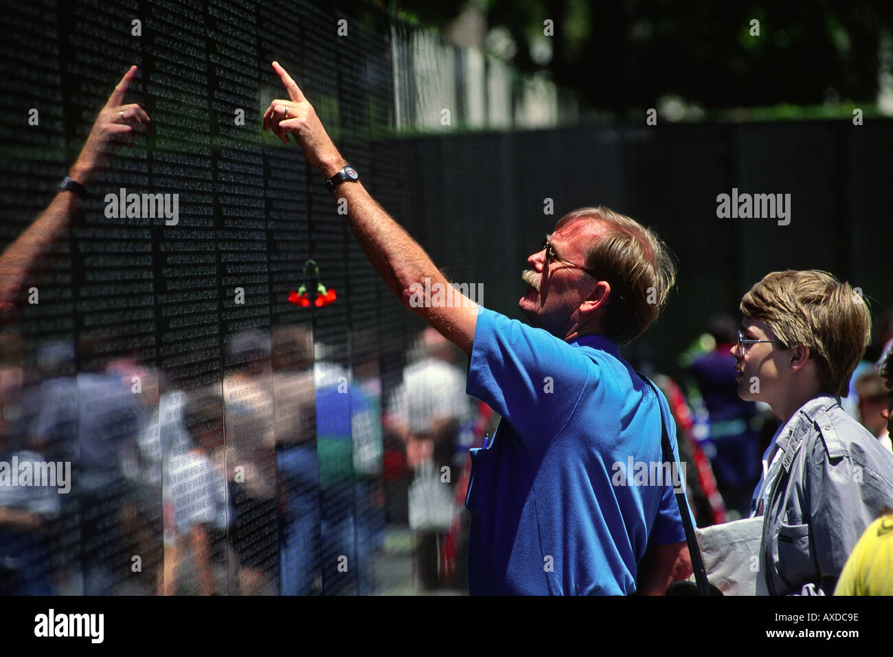 Father and son at the Vietnam Memorial wall in Washington DC USA Stock Photo