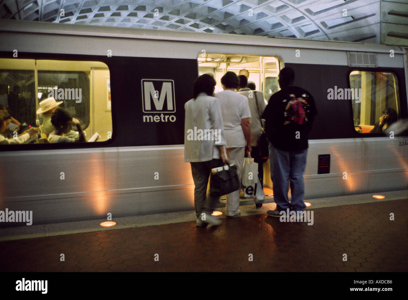 Passengers boarding metro train at underground station Washington DC