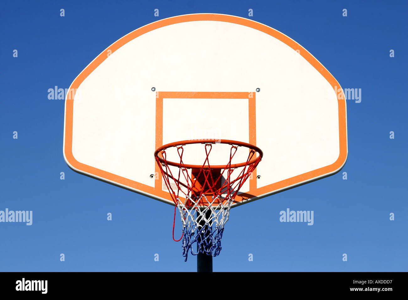 Basketball basket against a clear blue sky Stock Photo