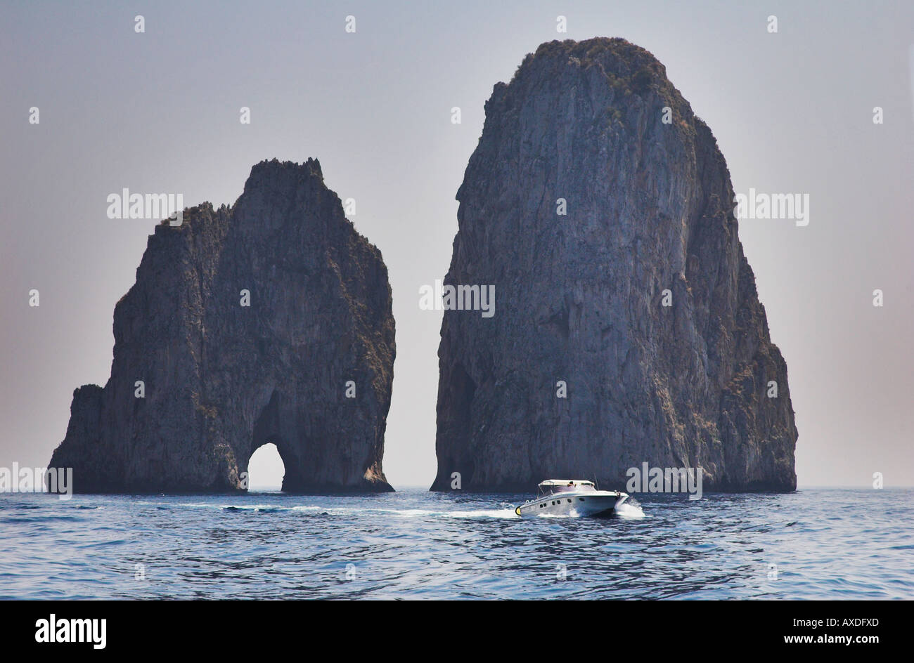Speed Boat and Faraglioni Rocks Capri Campania Italy Stock Photo