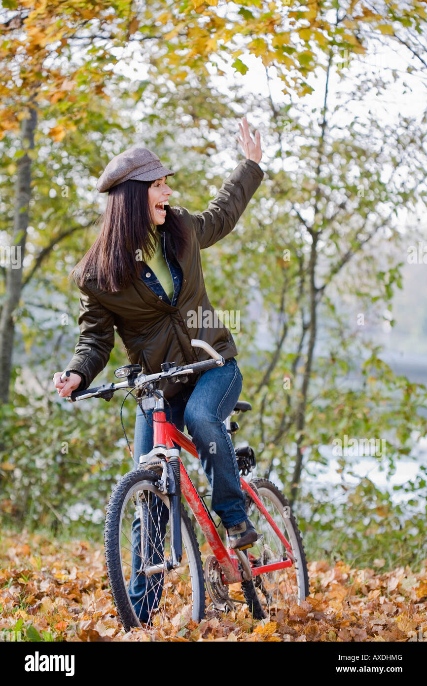 Young woman biking, portrait Stock Photo - Alamy