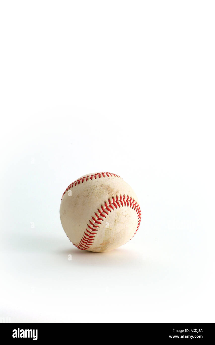 Leather baseball with red stitching slightly dirty as is used in American Baseball Games room for type vertical Stock Photo