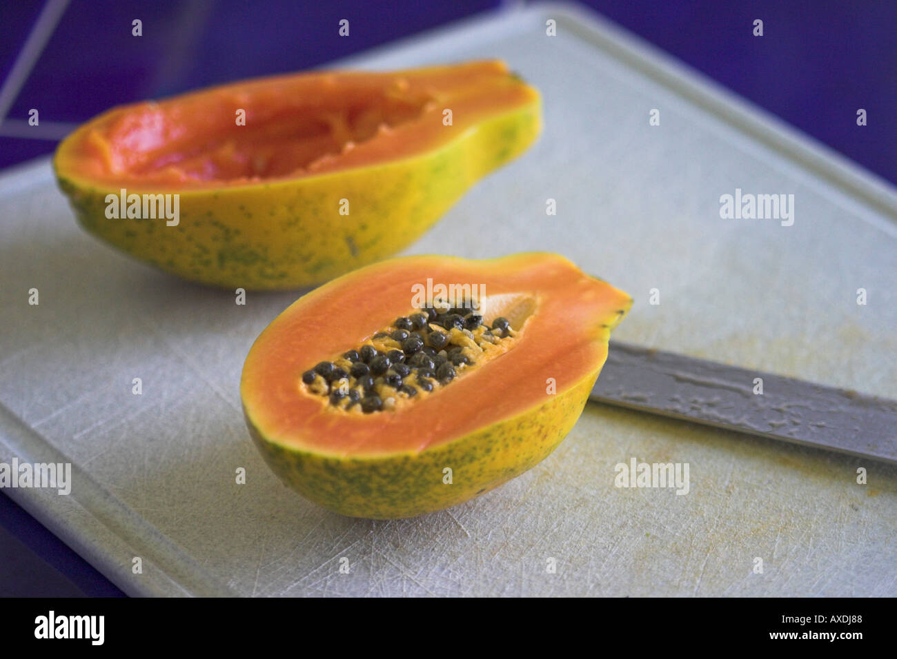 Papaya and Seeds with board Stock Photo