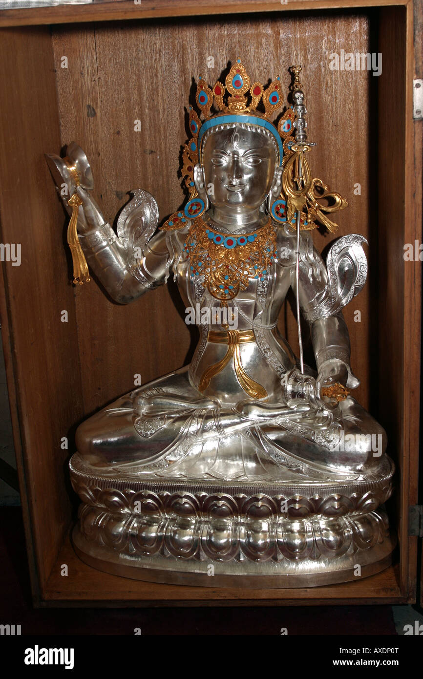 India Himachal Pradesh Norbulingka Institute Tibetan carving and carpentry school silver deity made in metal workshop Stock Photo