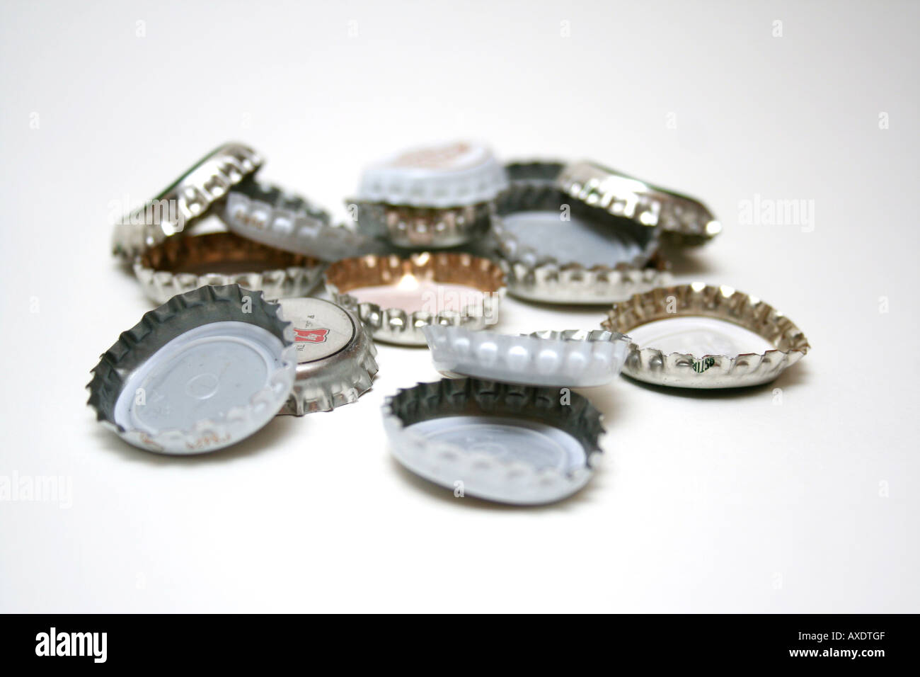 Beer bottle tops on white background Stock Photo Alamy