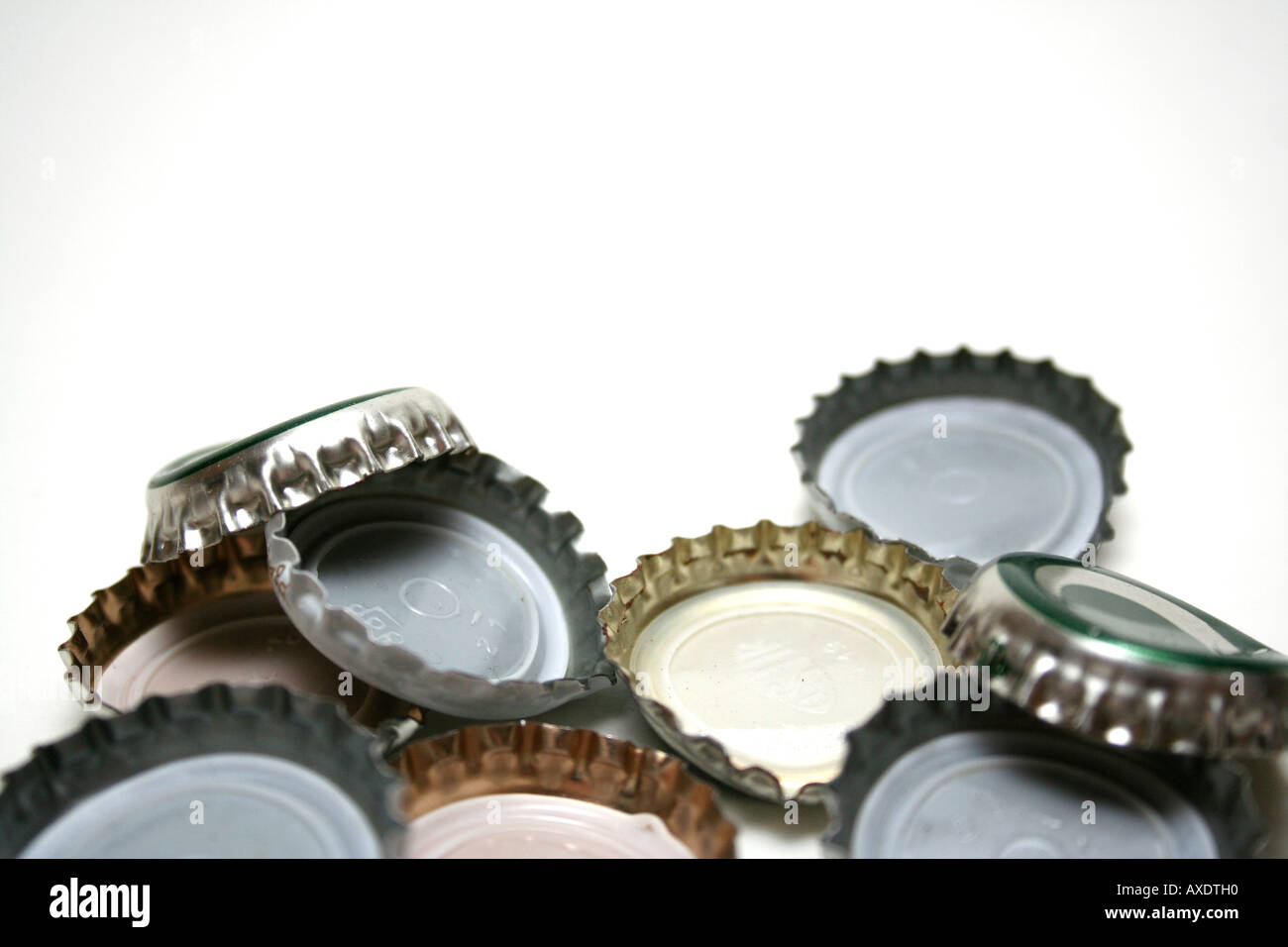 Beer bottle tops on white background Stock Photo Alamy