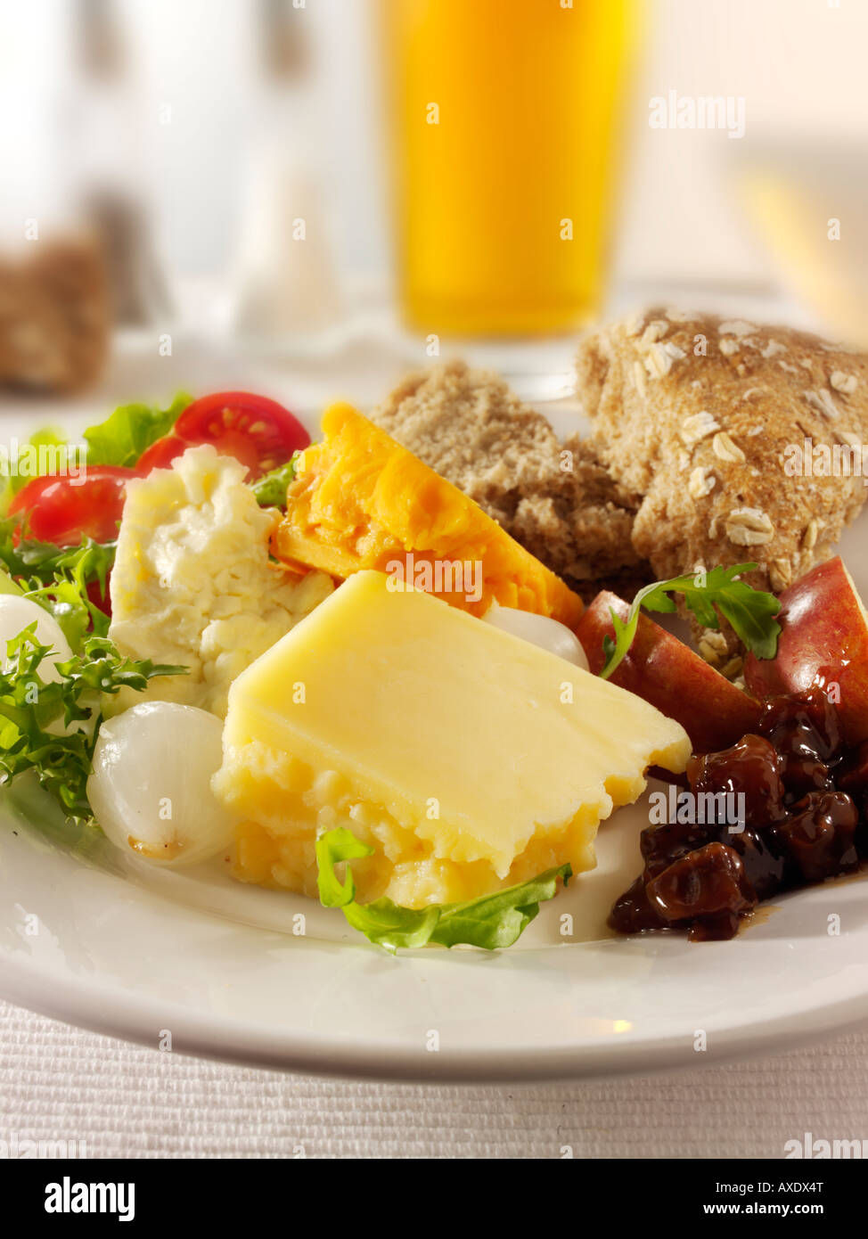 Traditional cheese Ploughman's with Cheddar & Red Leicester in a pub setting Stock Photo
