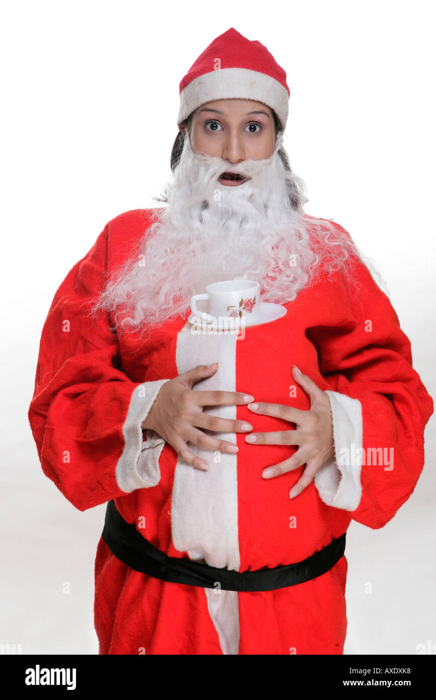 Portrait of a woman wearing santa claus costume and drinking tea Stock Photo Alamy