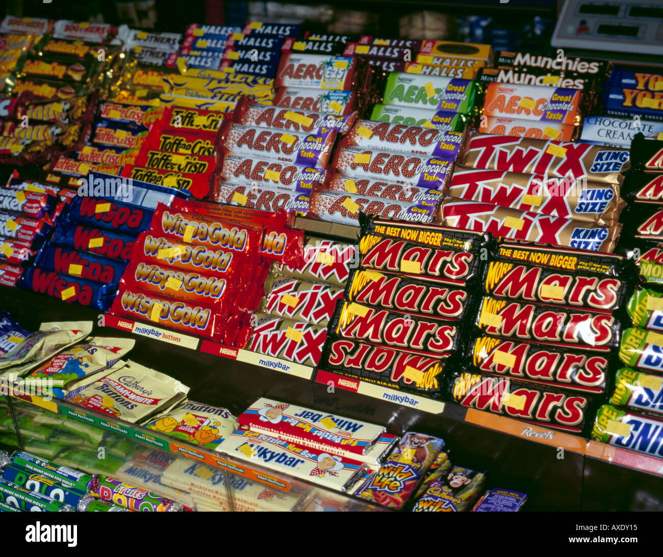 Display of confectionery in a newsagents kiosk, England, UK Stock Photo