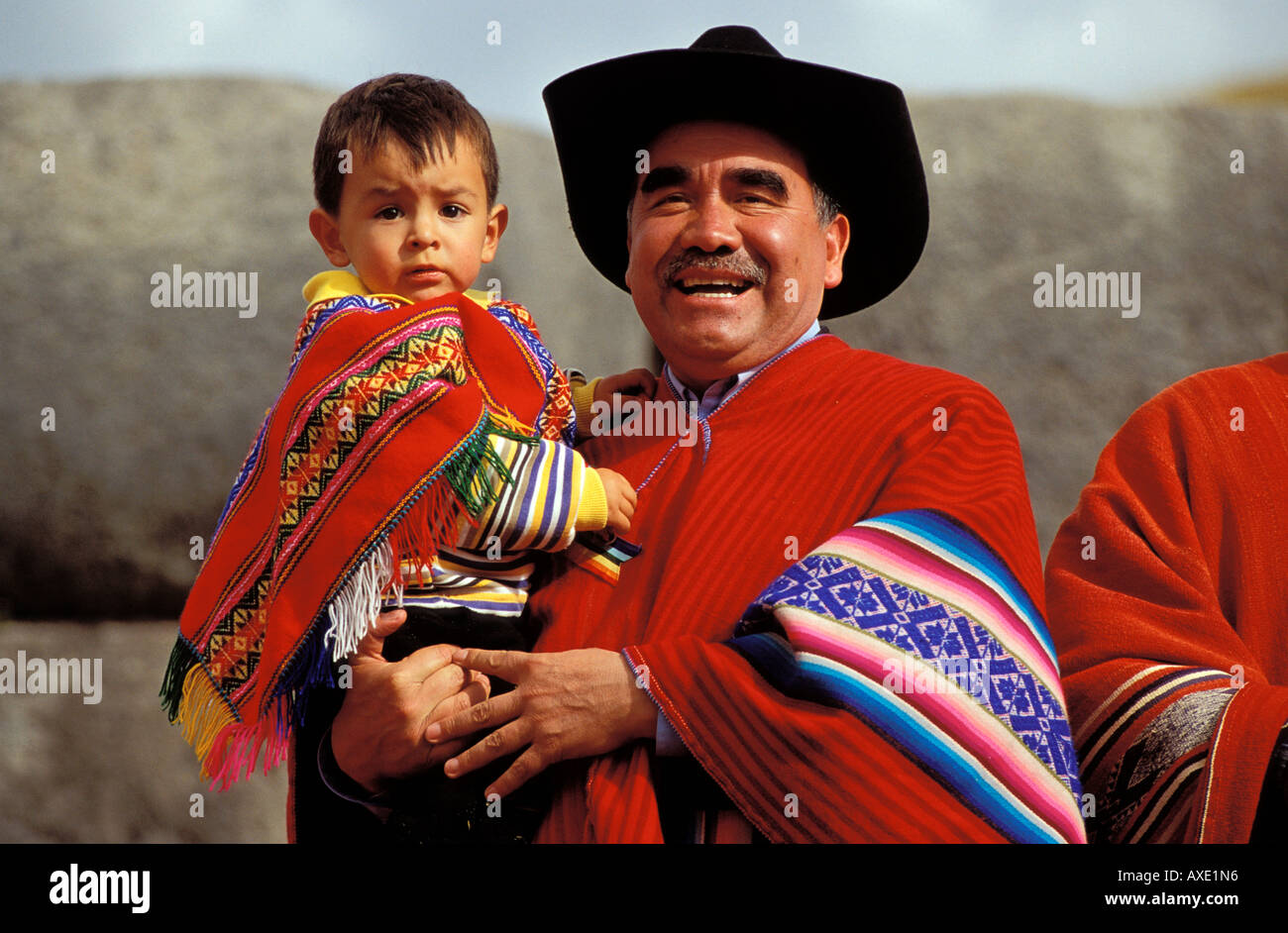 Peruvian Father Man with child on his arm . father and son in typical clothes ...