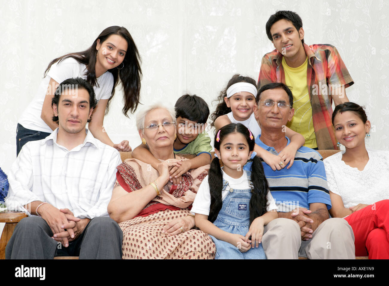 Indian group joint family sitting hires stock photography and images