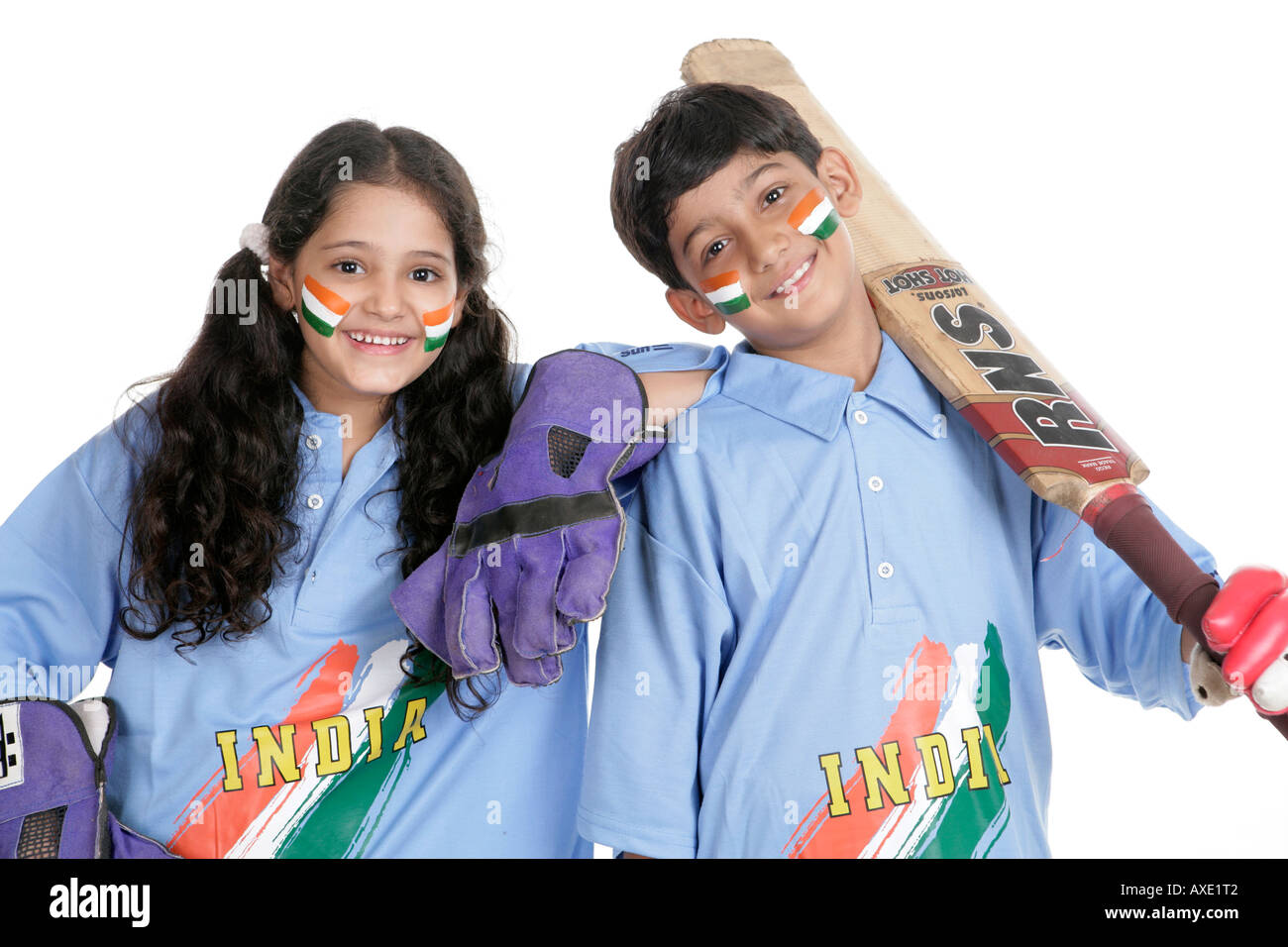 Portrait of a boy and a girl wearing indian cricket team uniform Stock Photo