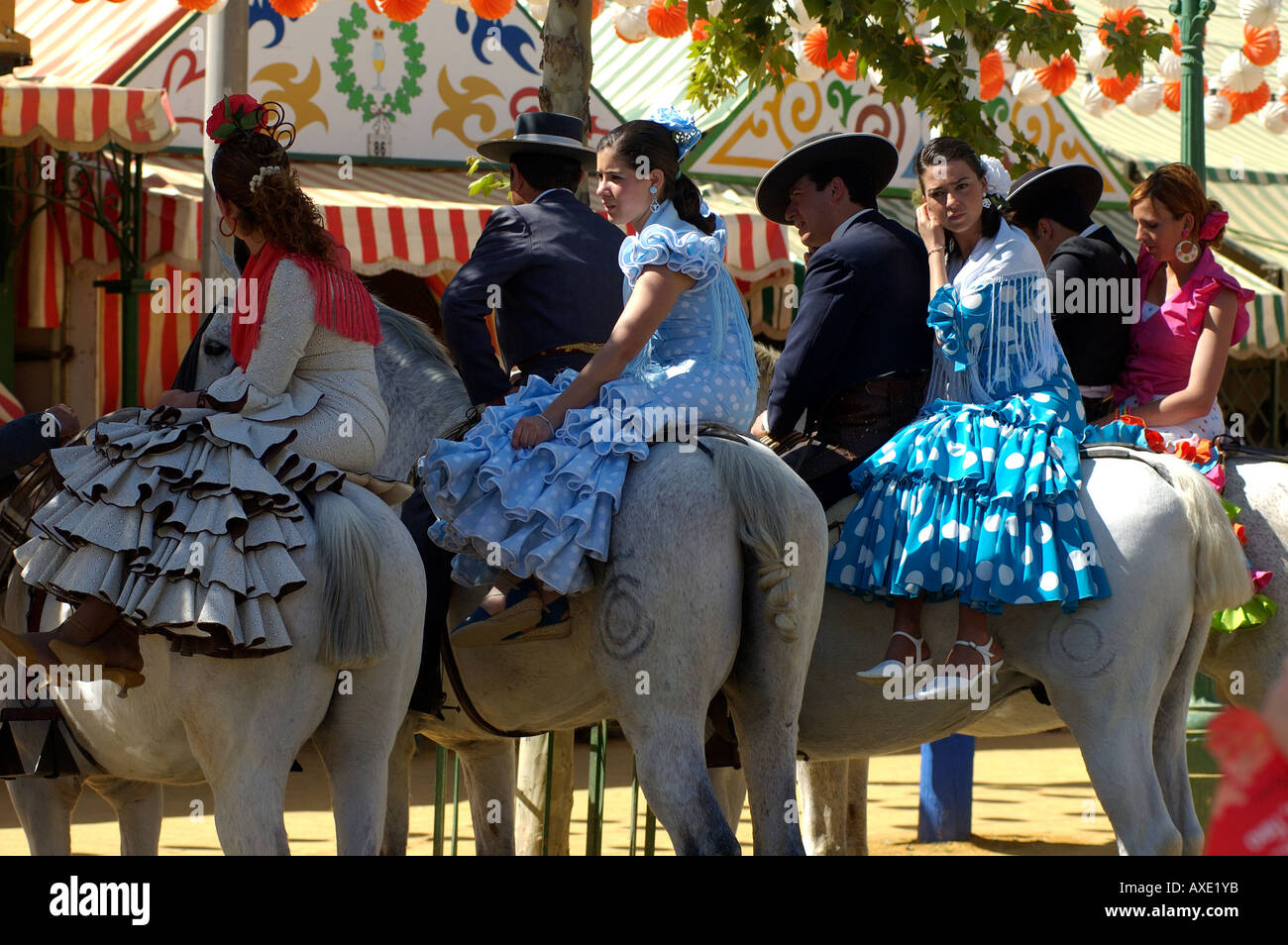 Feria de Abril , Pairs ride from fixed tent to fixed tent , Seville , Andalusia , Spain , Europe Stock Photo