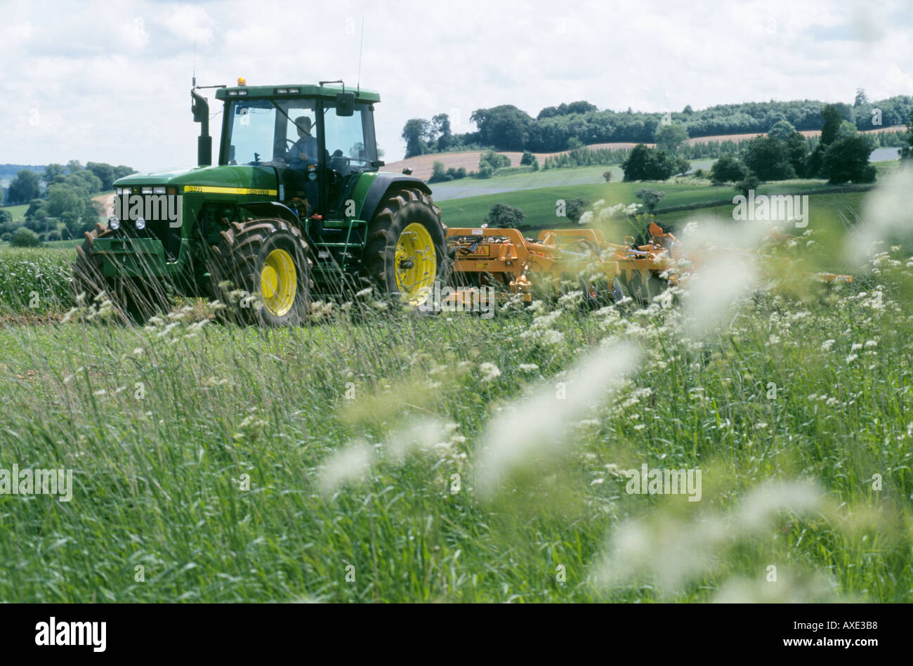 UK COTSWOLDS MORETONINMARSH TRACTOR WITH PLOUGH FARMING COUNTRYSIDE