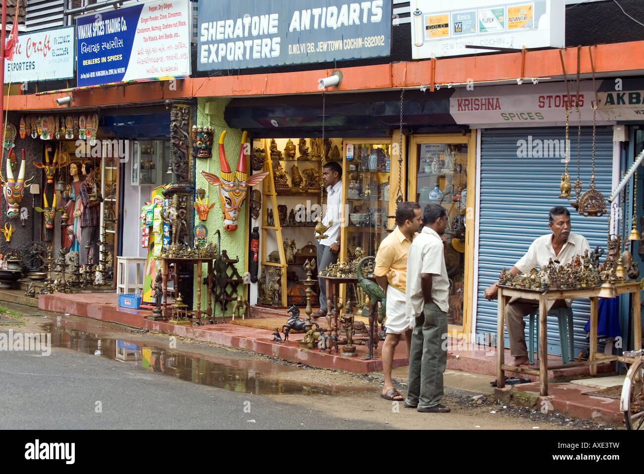 Small shops selling Indian antiques and reproductions lining 'Jew Street' in 'Jew Town' Mattancherry Kochi Cochin Kerala South I Stock Photo