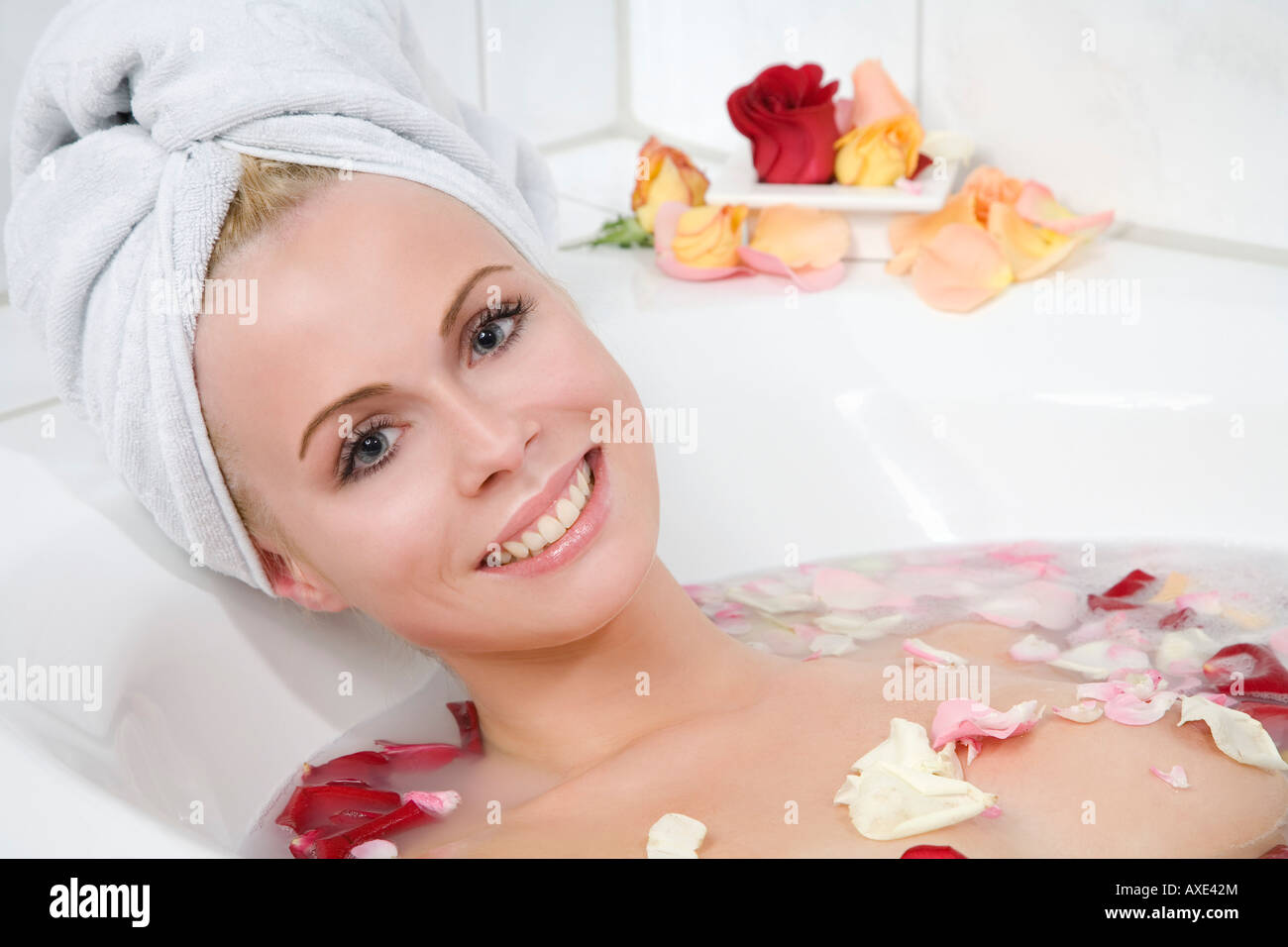 Woman, 35, relaxing in a bathtub with rose petals, Thalasso therapy in a  spa resort Stock Photo - Alamy