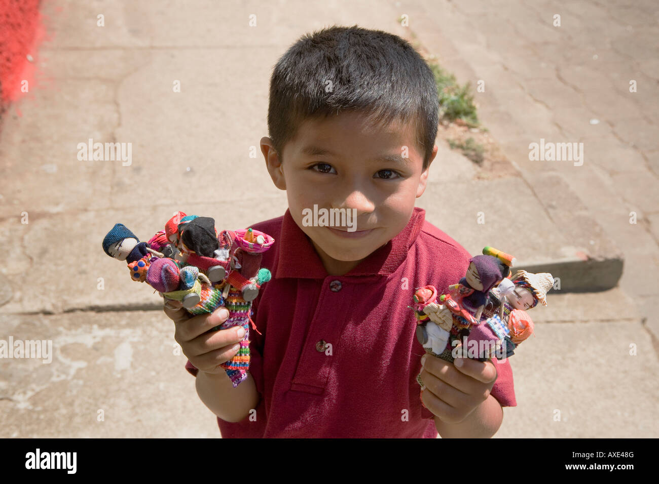 Little boy 5 selling artisan finger puppet toys in Juayua El Salvador