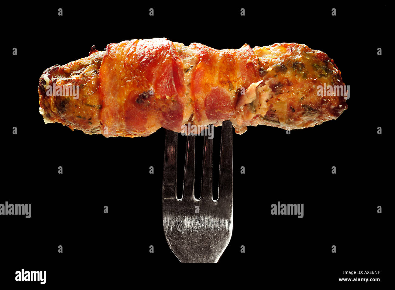 Pork sausage wrapped in bacon Stock Photo