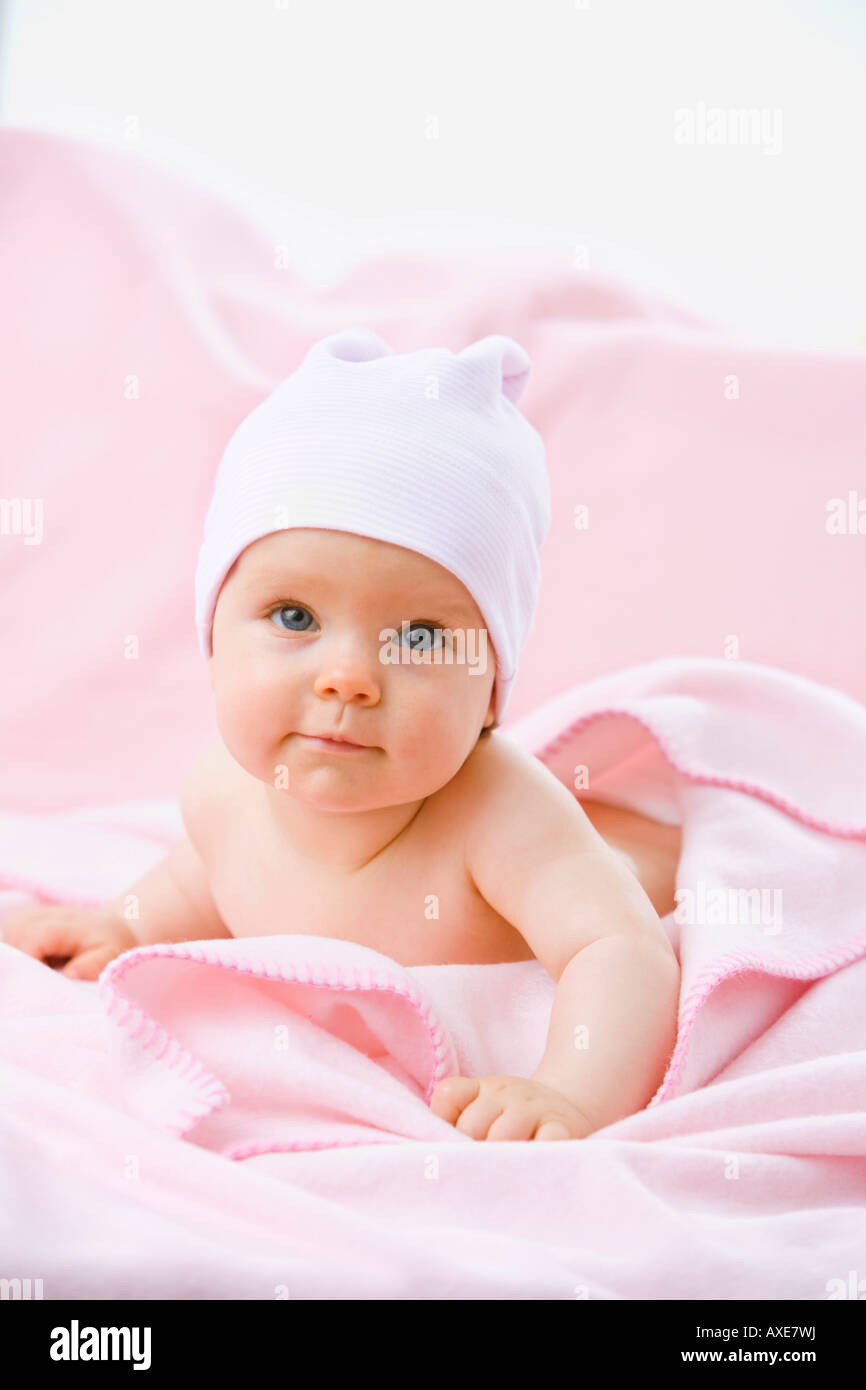 Baby girl (69 months) lying on belly Stock Photo Alamy