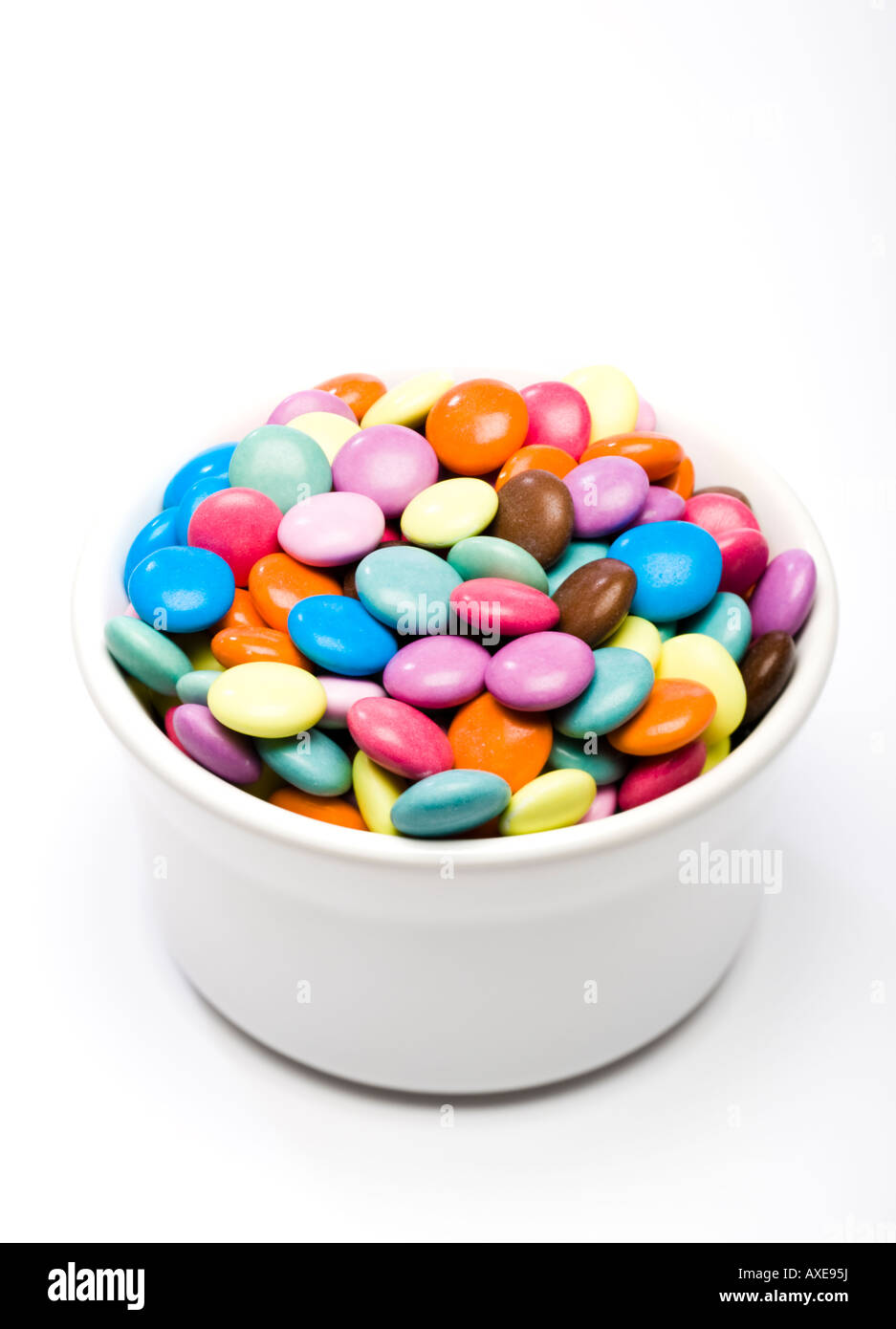 Candy covered chocolate buttons in a bowl Stock Photo Alamy