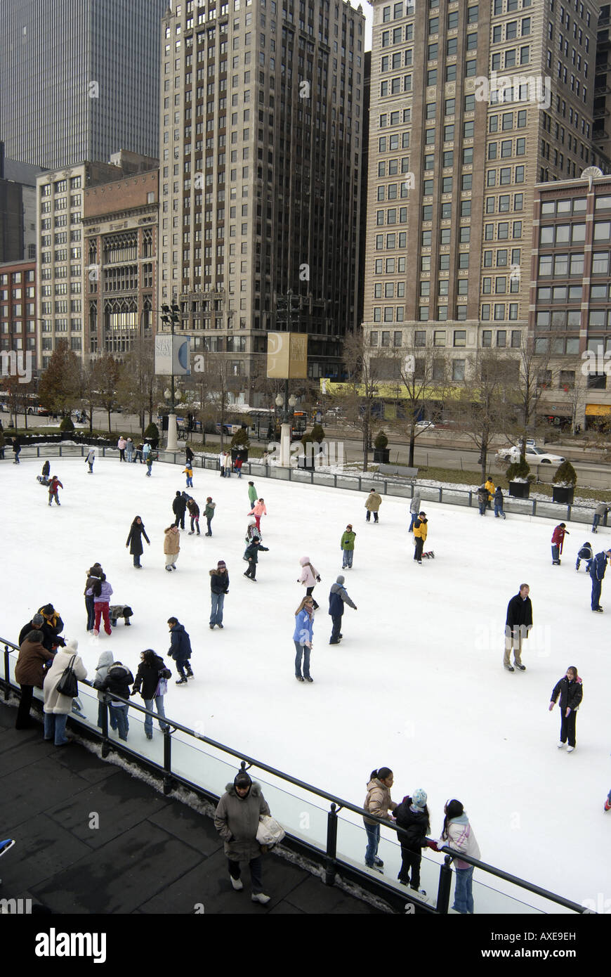 Ice skating at Millennium Park in Chicago with Michigan Avenue in the