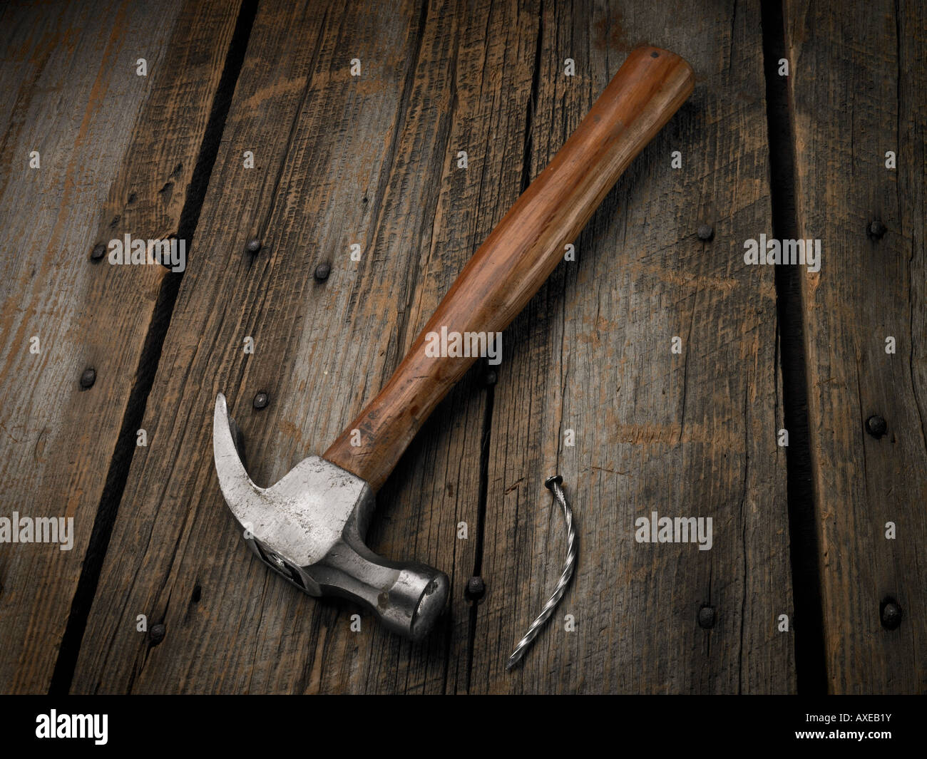 Hammer and bent nail shot on a rustic barn board surface Stock Photo - Alamy