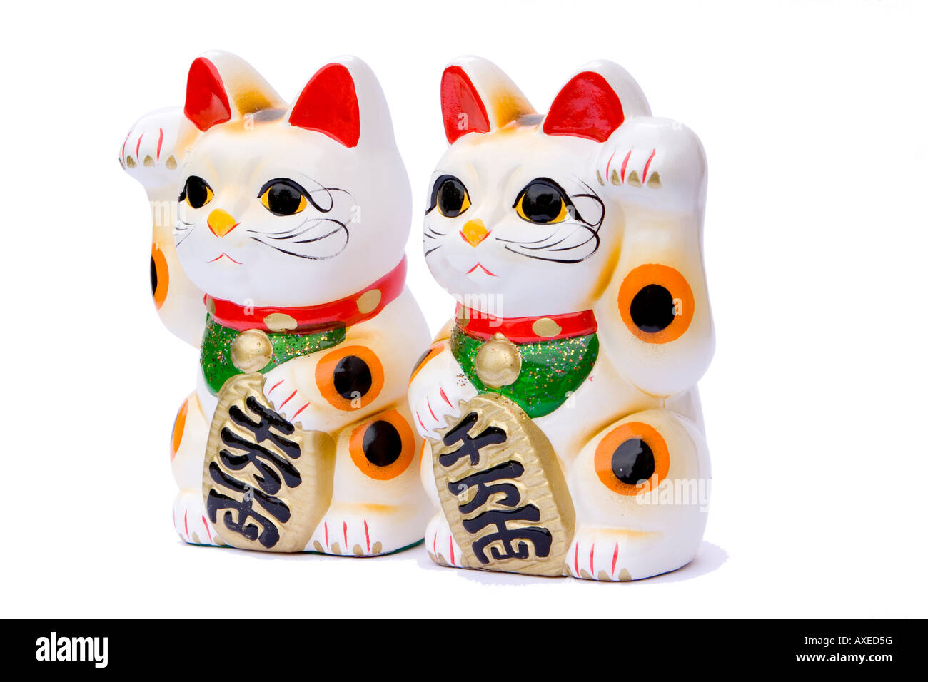 pair of japanese maneki neko waving fortune cats Stock Photo