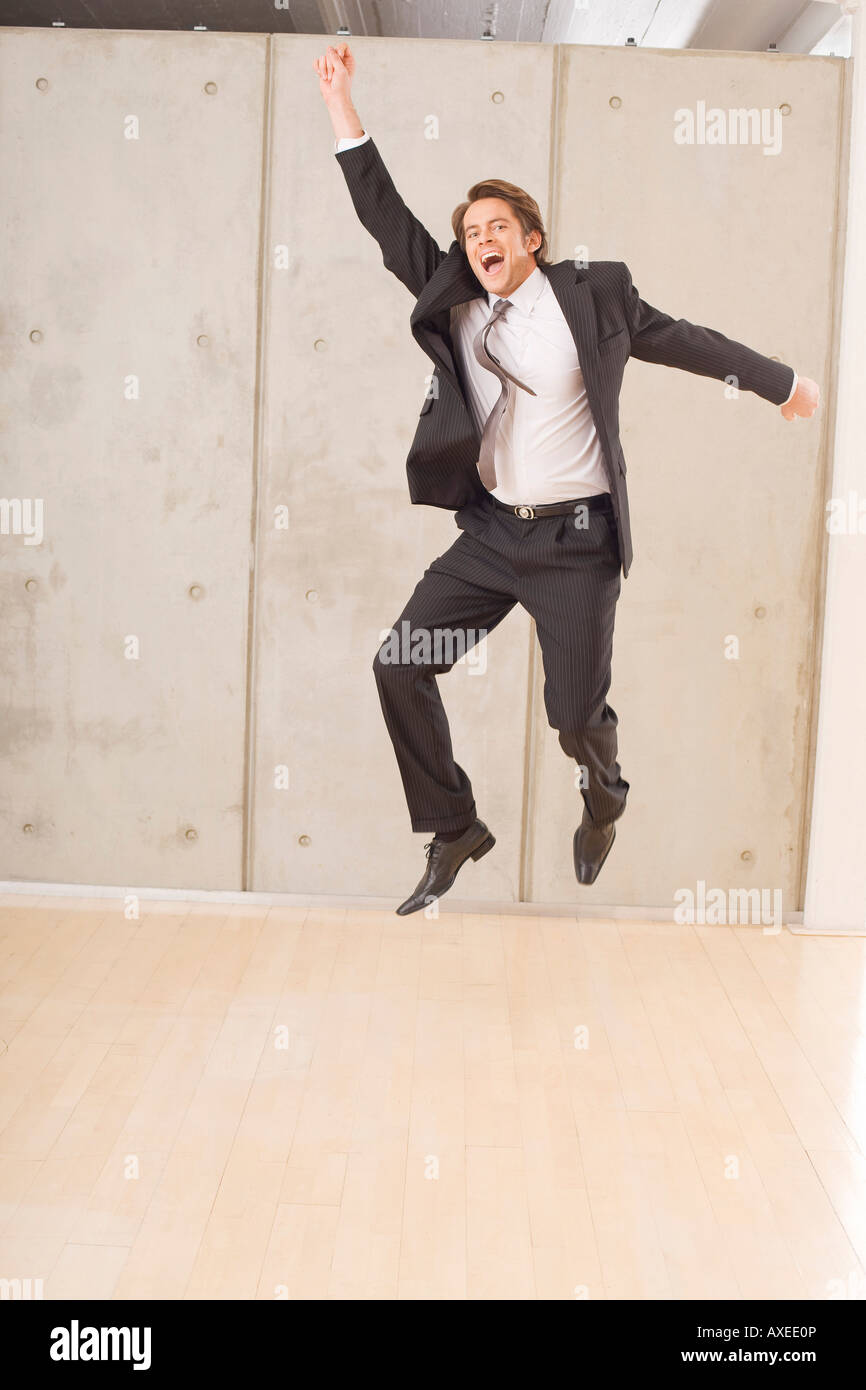 Businessman cutting a caper Stock Photo Alamy