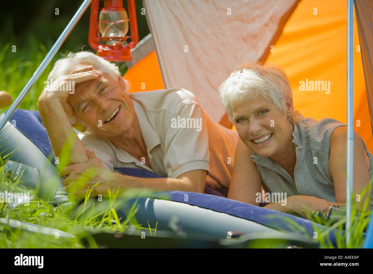 Senior couple relaxing in tent, portrait Stock Photo - Alamy