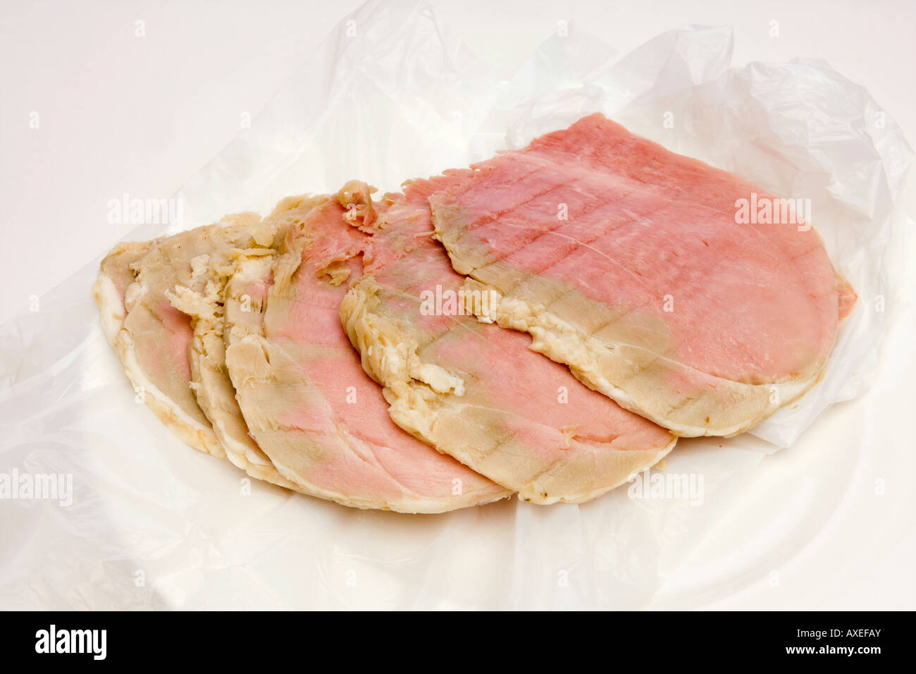 food poisoning slices of ham dangerously beyond sell by date Stock