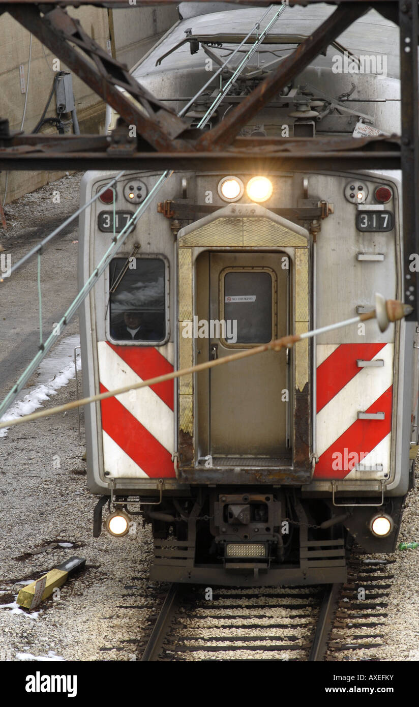 A Metra commuter train leaves an underground station in Chicago. Stock Photo