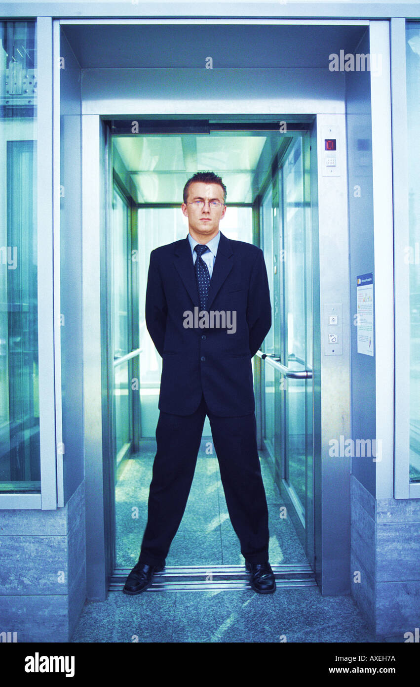 Man Age 30 35 Young Business Businessman Glasses Tie Suit Stand Lift Entry Vitreous Interior Inside Dark Haired Stock Photo Alamy