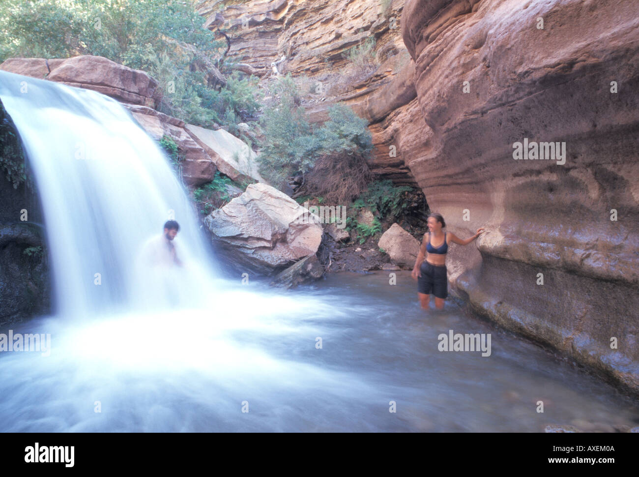 Couple Bathing in Waterfall Stock Photo Alamy