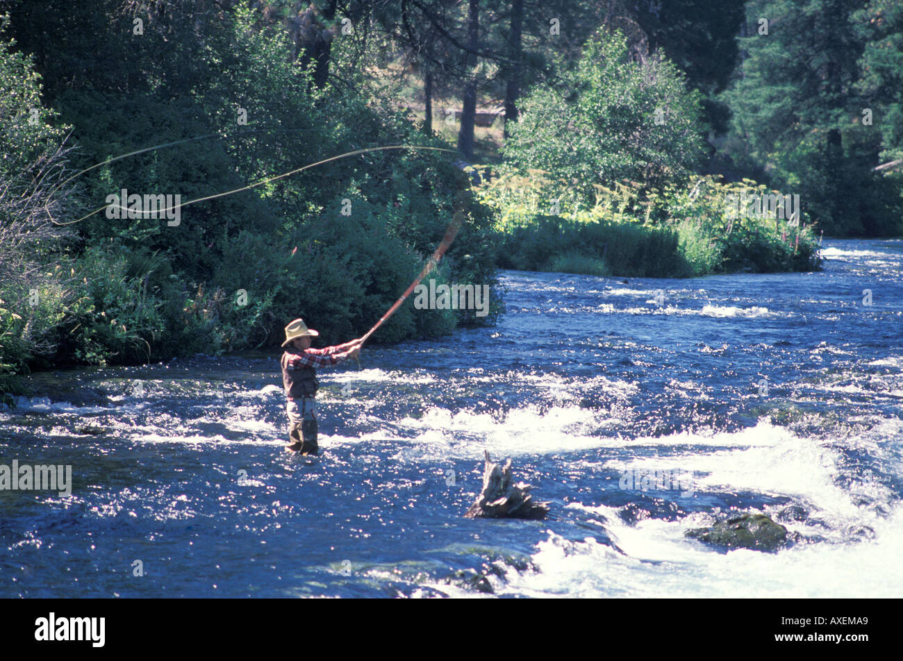 Cowboy Fly Fishing In A Mountain River Stock Photo Alamy