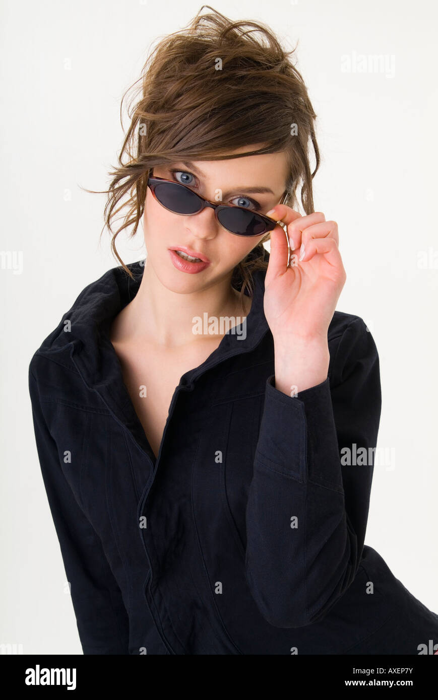Portrait of young woman wearing sunglasses Stock Photo - Alamy
