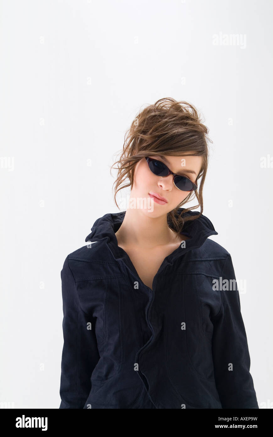 Portrait of young woman wearing sunglasses Stock Photo - Alamy