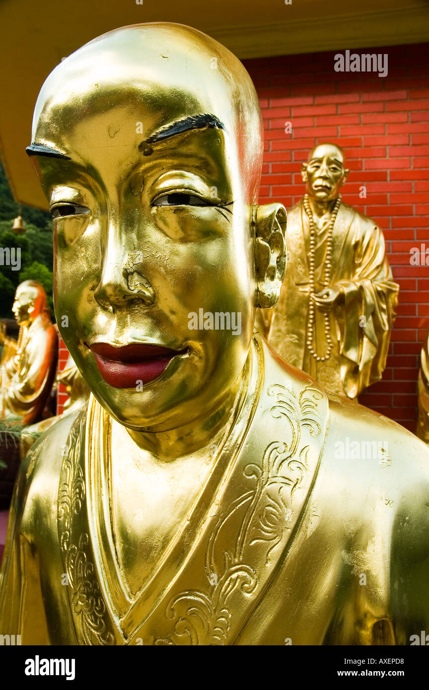 Life size gold Buddhist statues at the Temple of 10000 Buddhas in Hong