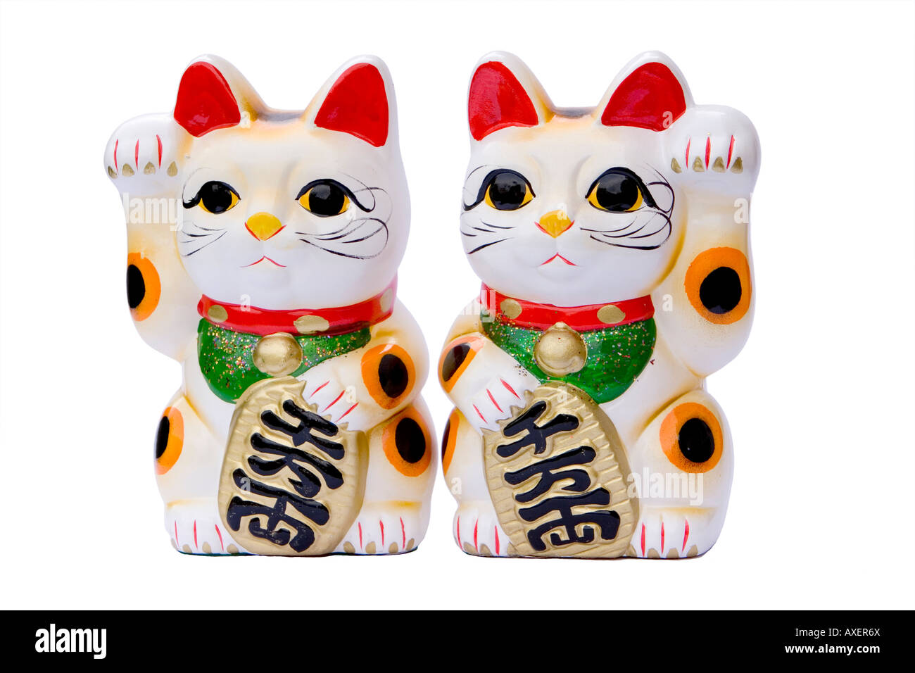 paif of japanese maneki neko waving fortune cats Stock Photo