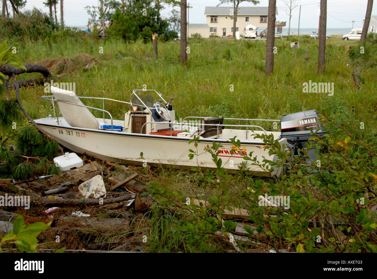 Storm wind damage hurricane boat pushed far inshore Stock Photo
