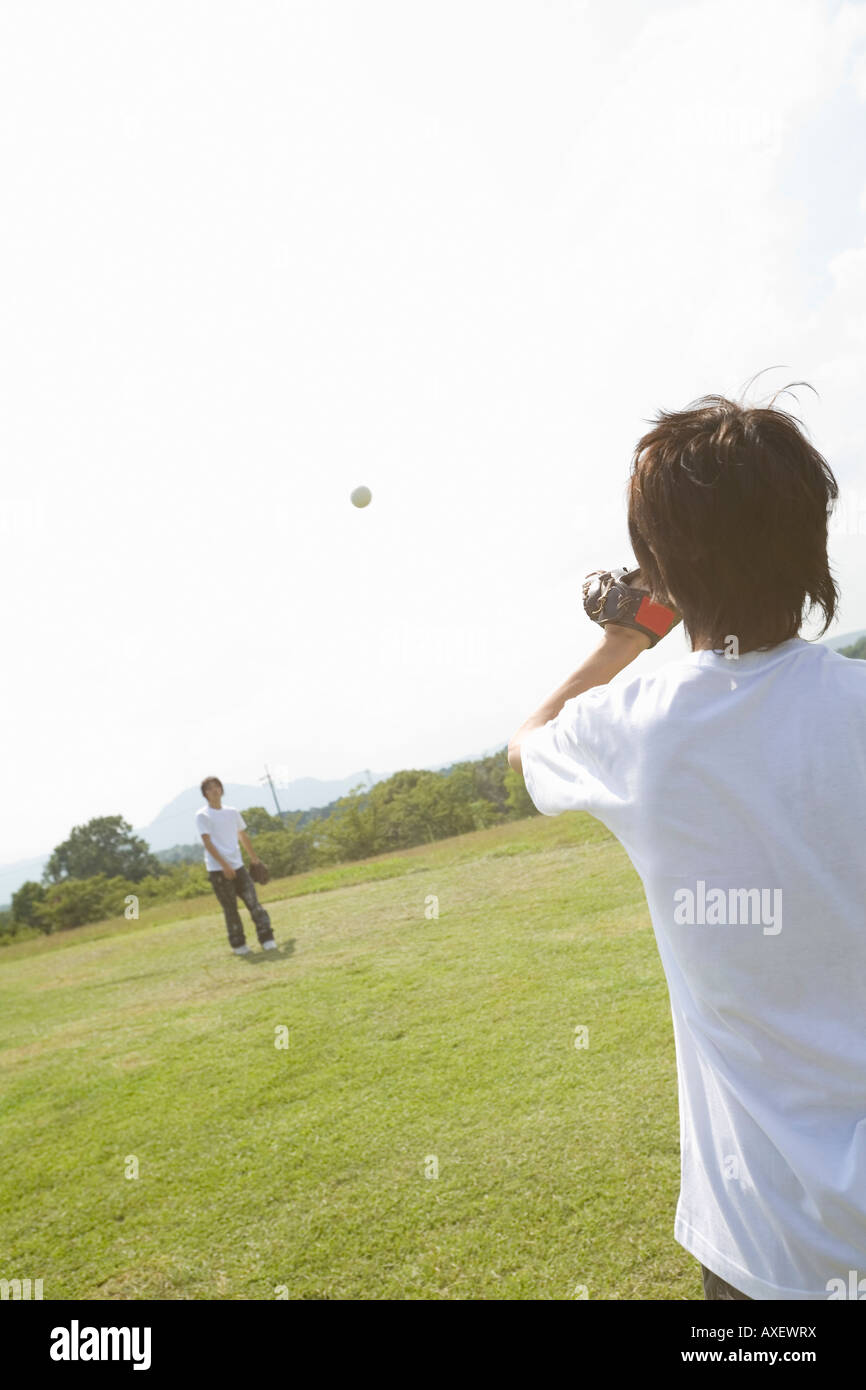 Two teenage boys playing catch Stock Photo