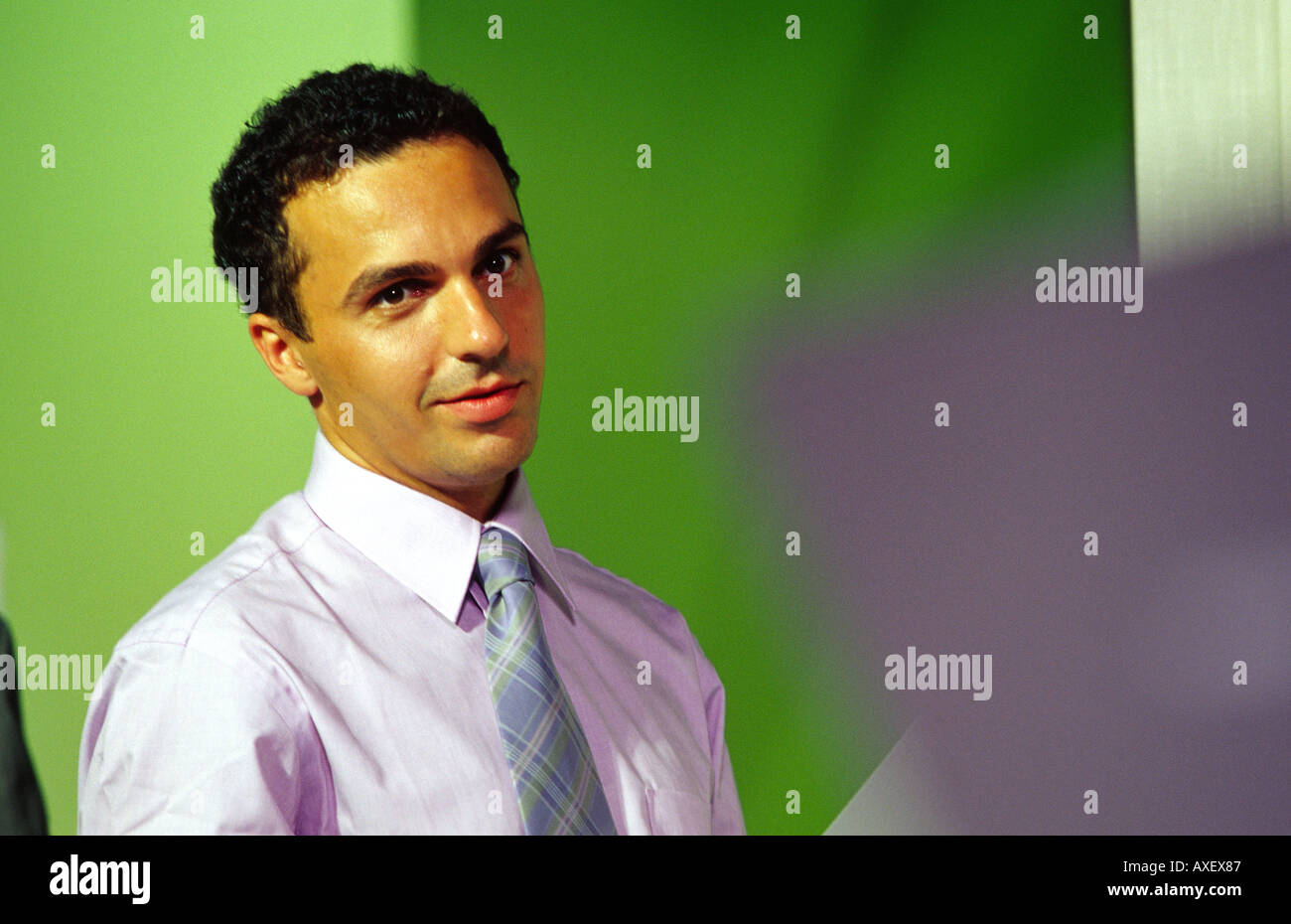 man male age 25 30 young slim fit dark haired businessman look smile content tie indoor interior