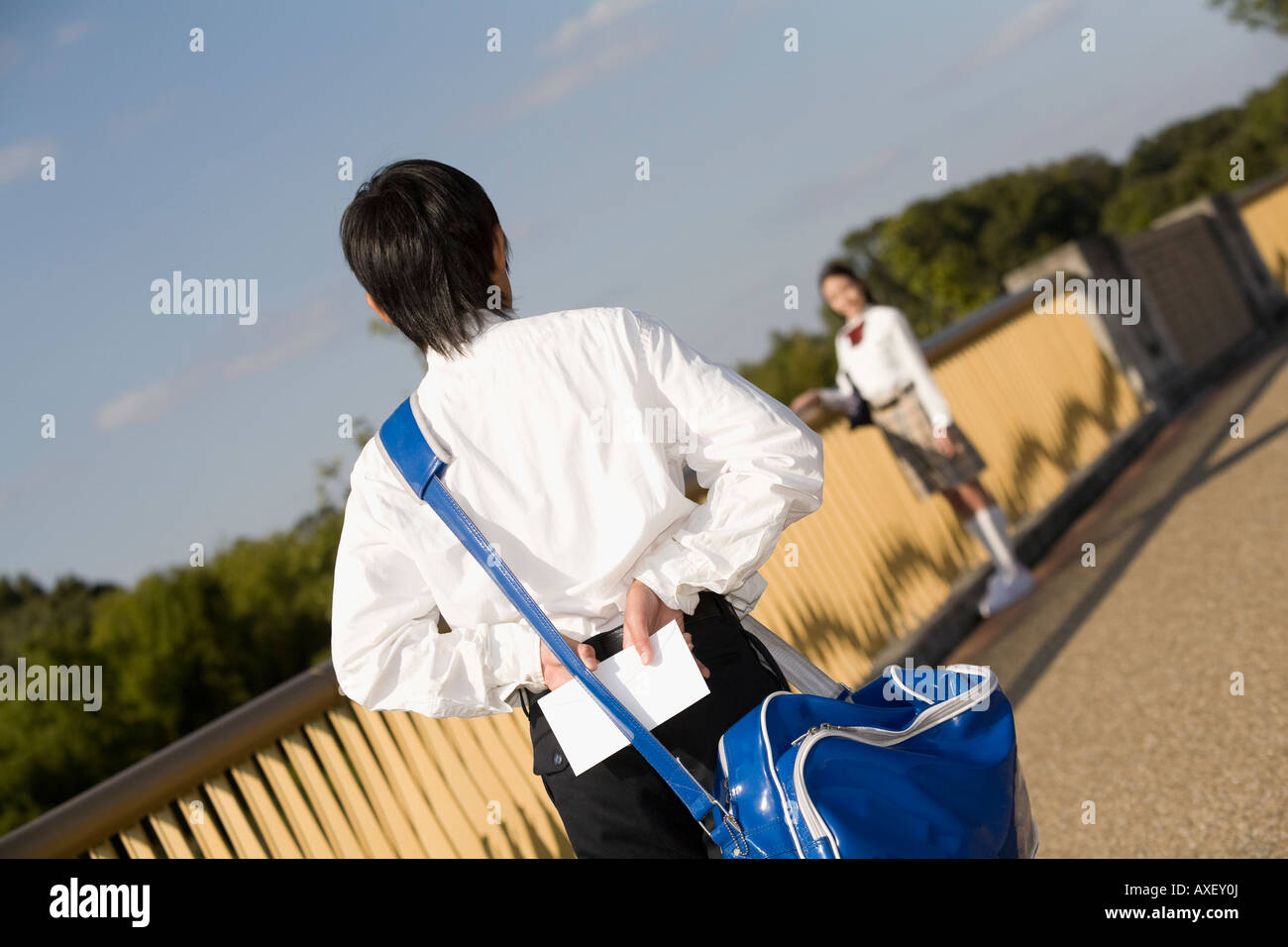 Schoolboy holding love letter Stock Photo
