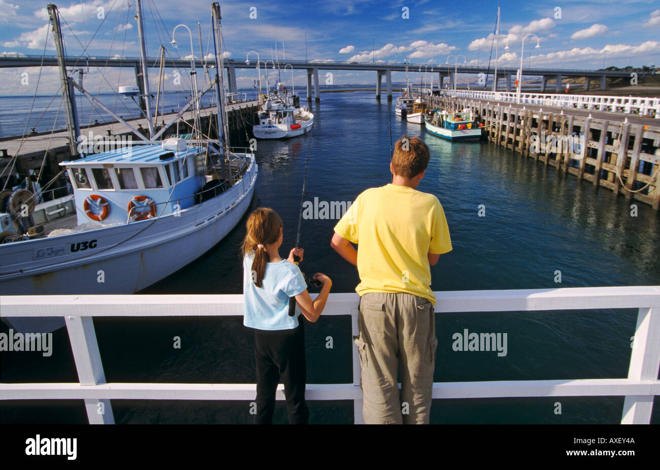 Fishing off jetty at fishing boat harbour San Remo Phillip Island