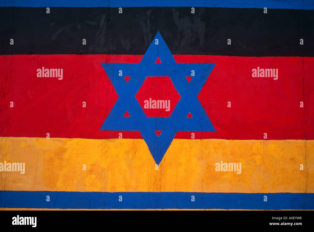 Graffiti detail from the Berlin Wall showing the Israeli Star of David over the German flag. Stock Photo