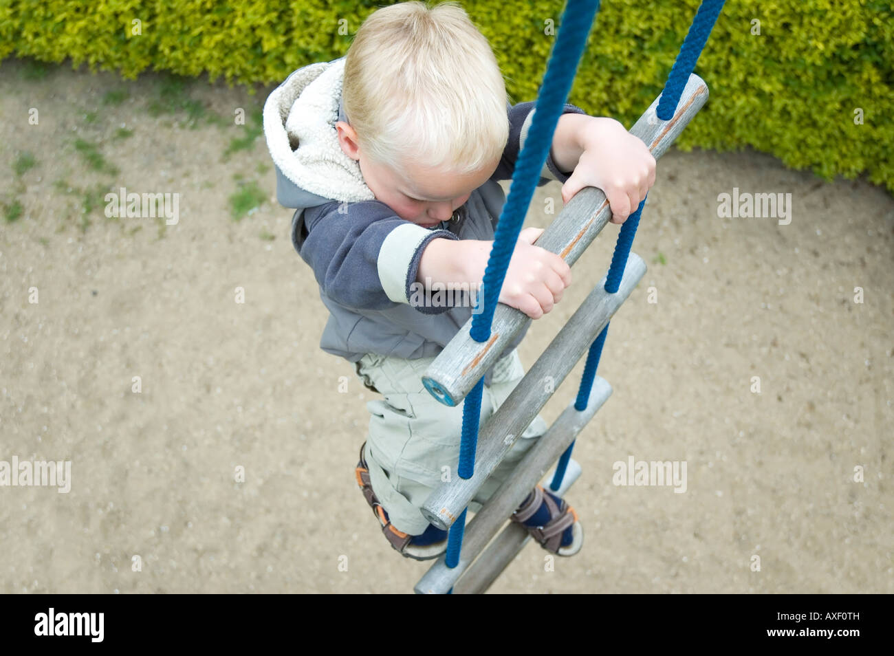 Kid climbing up stairs on a playground taken from above Stock Photo Alamy