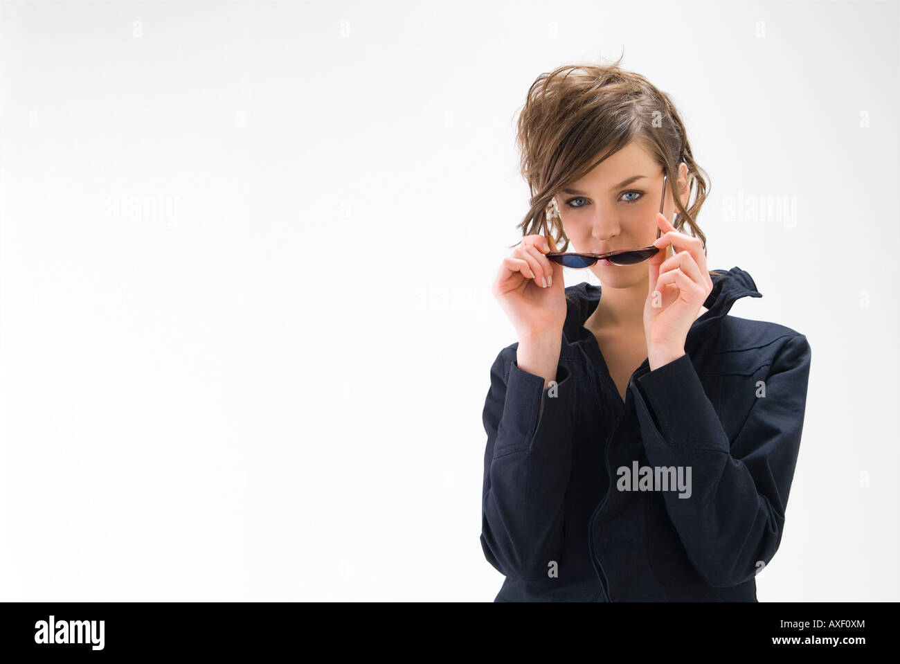 Portrait of young woman wearing sunglasses Stock Photo - Alamy