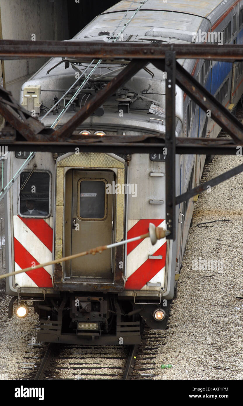A Metra commuter train leaves an underground station in Chicago Stock Photo